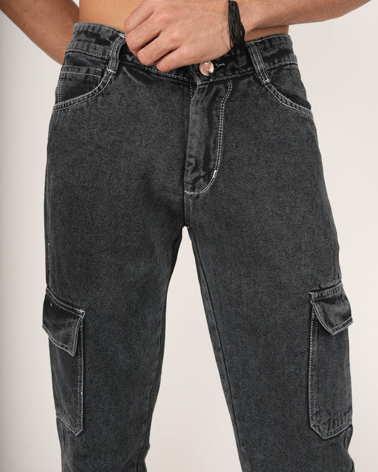 A man wearing black 6-pocket cargo jeans.