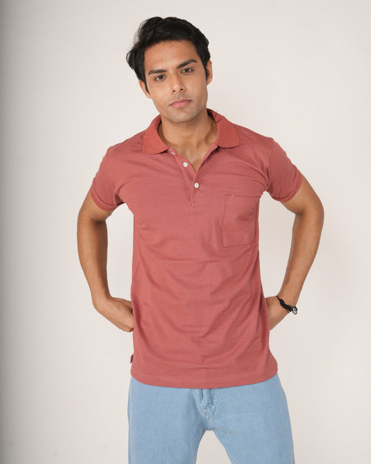 Man wearing a Rust-Red Polo T-shirt and light blue jeans.