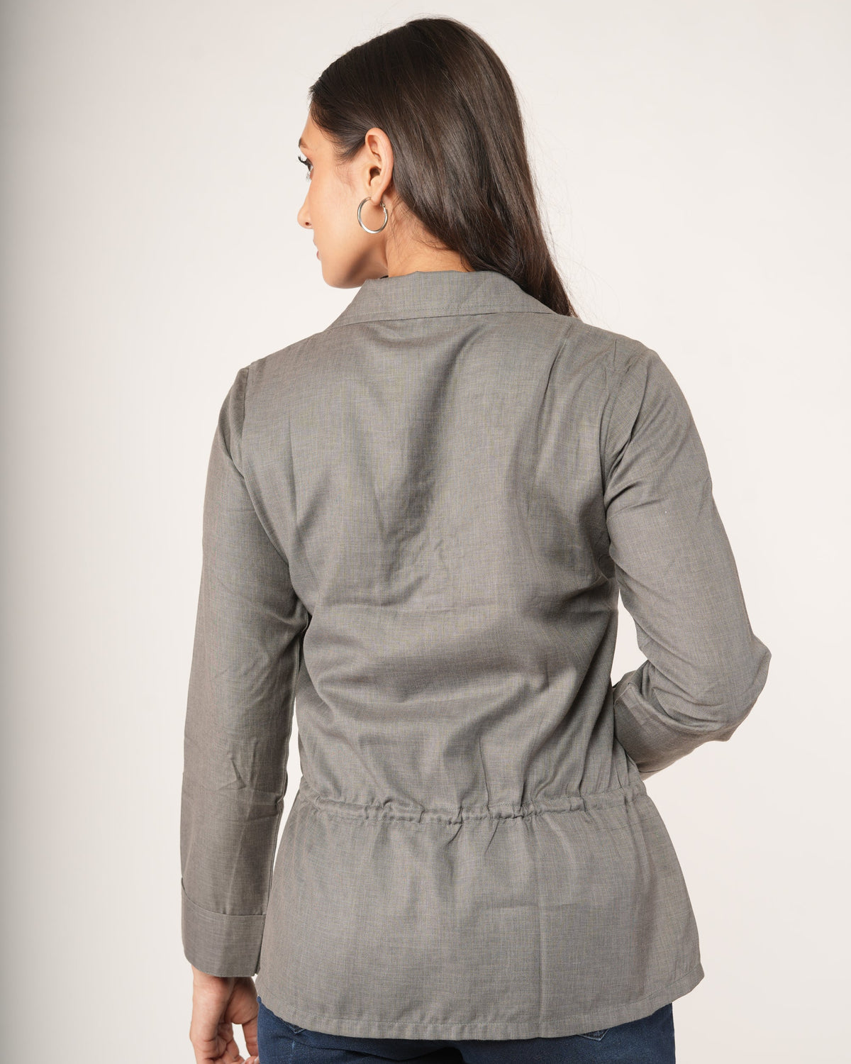 A woman modeling a gray long-sleeve top