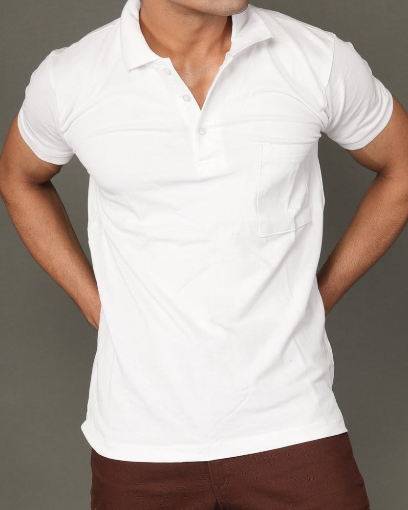 Man wearing a white polo t-shirt and brown pants.