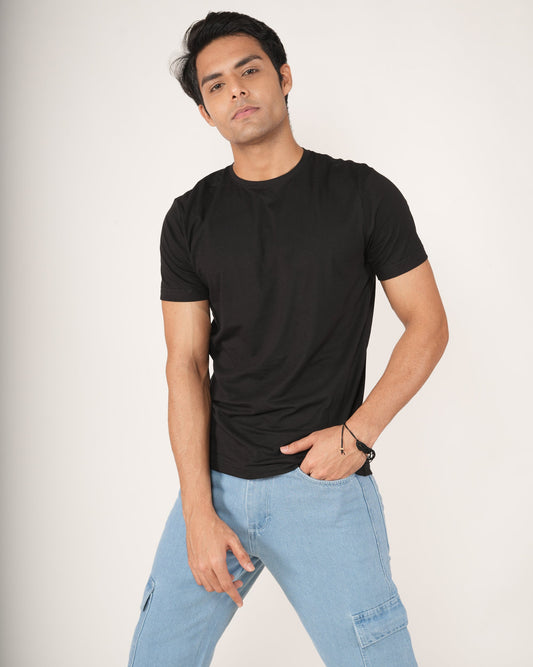 Men wearing a Black slim fit crew neck t-shirt and icy-blue 6 pocket jeans.