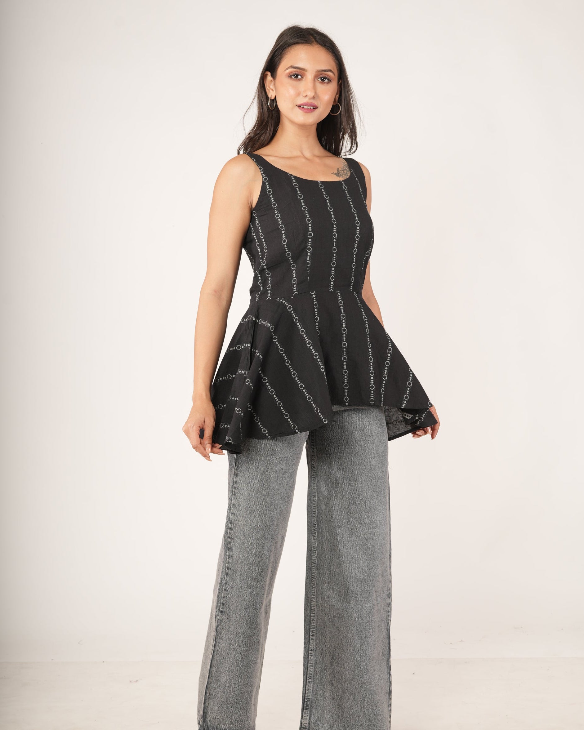 Women wearing Black striped flared top.