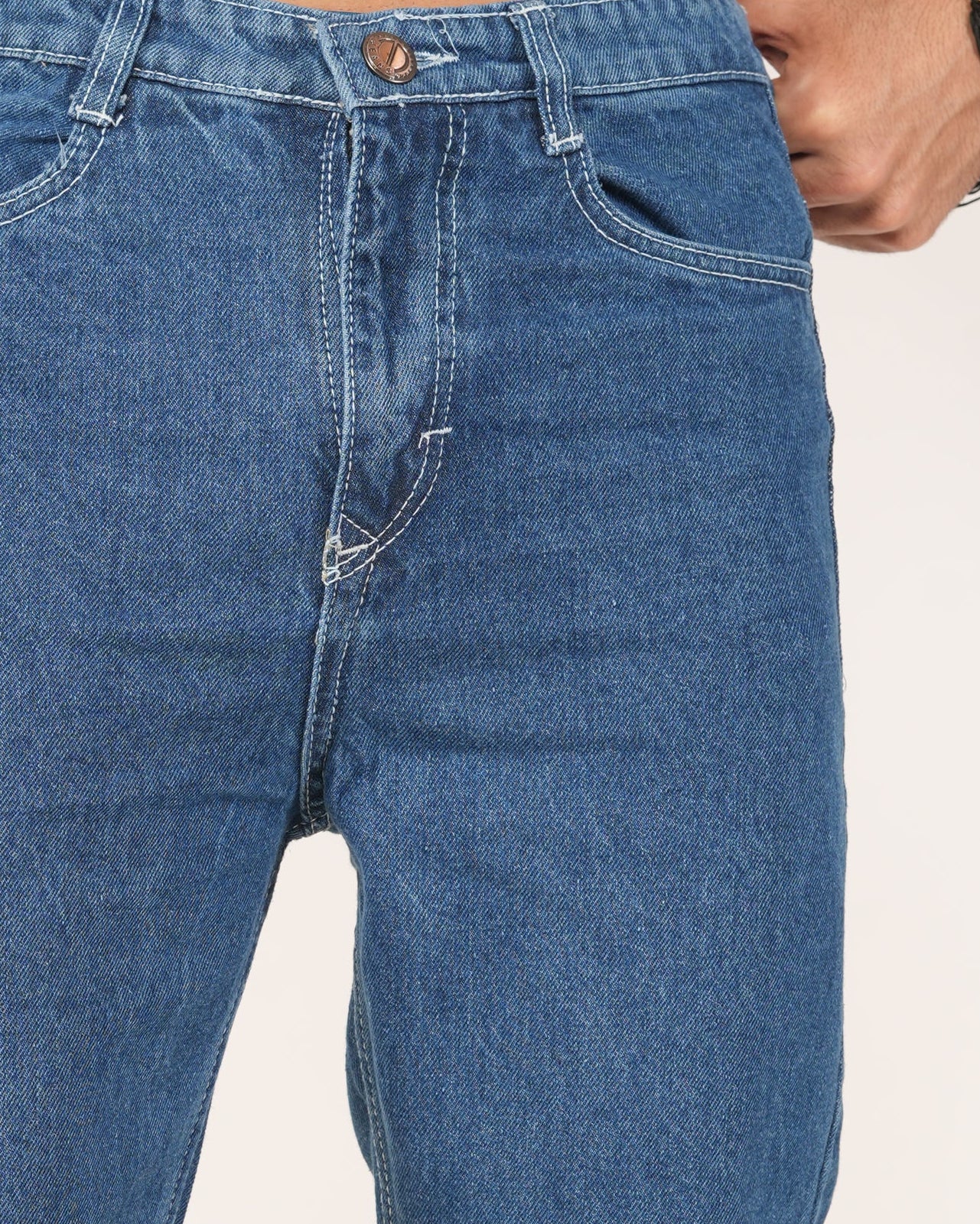 Blue jeans being stretched by a person.