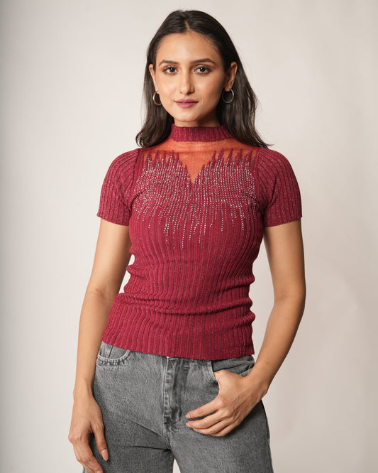 A woman modeling a short-sleeve Fiesta Red Sheer Mesh Yoke Rhinestone Ribbed Top, paired with gray jeans.