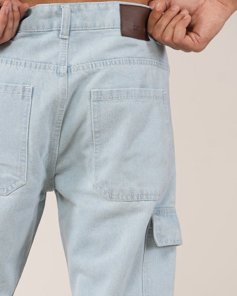 A model wearing Frost Ice Blue 8-pocket cargo jeans