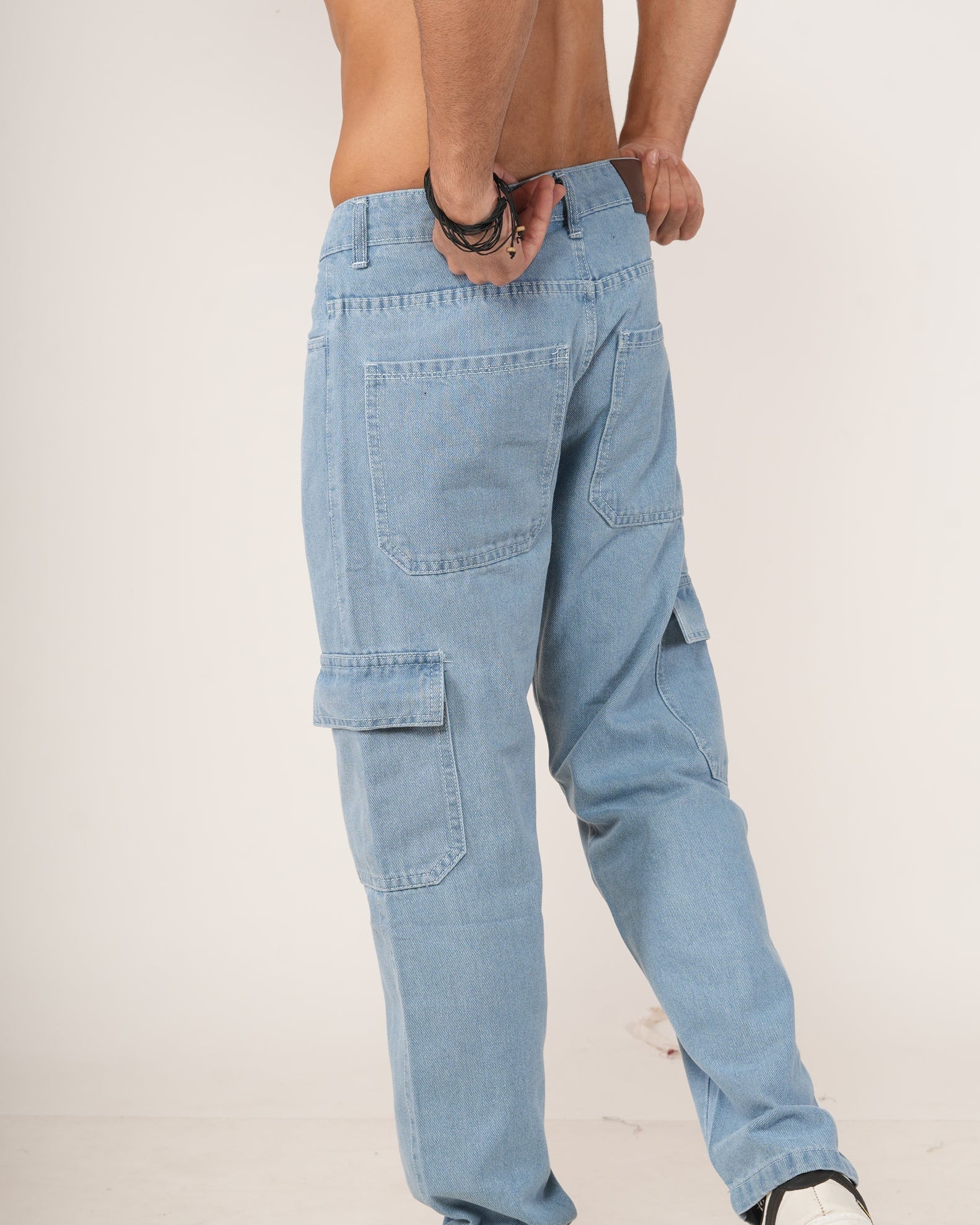 Person wearing sky blue jeans.