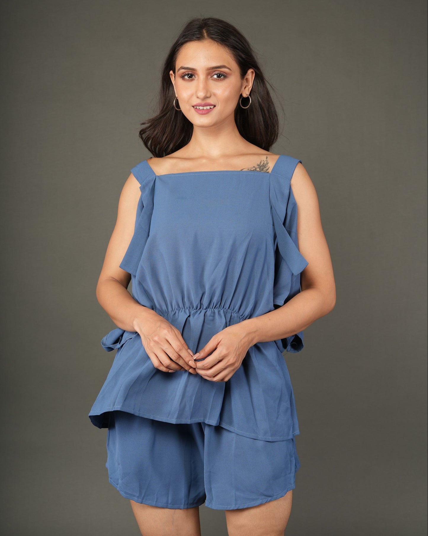 Woman wearing a blue layered outfit