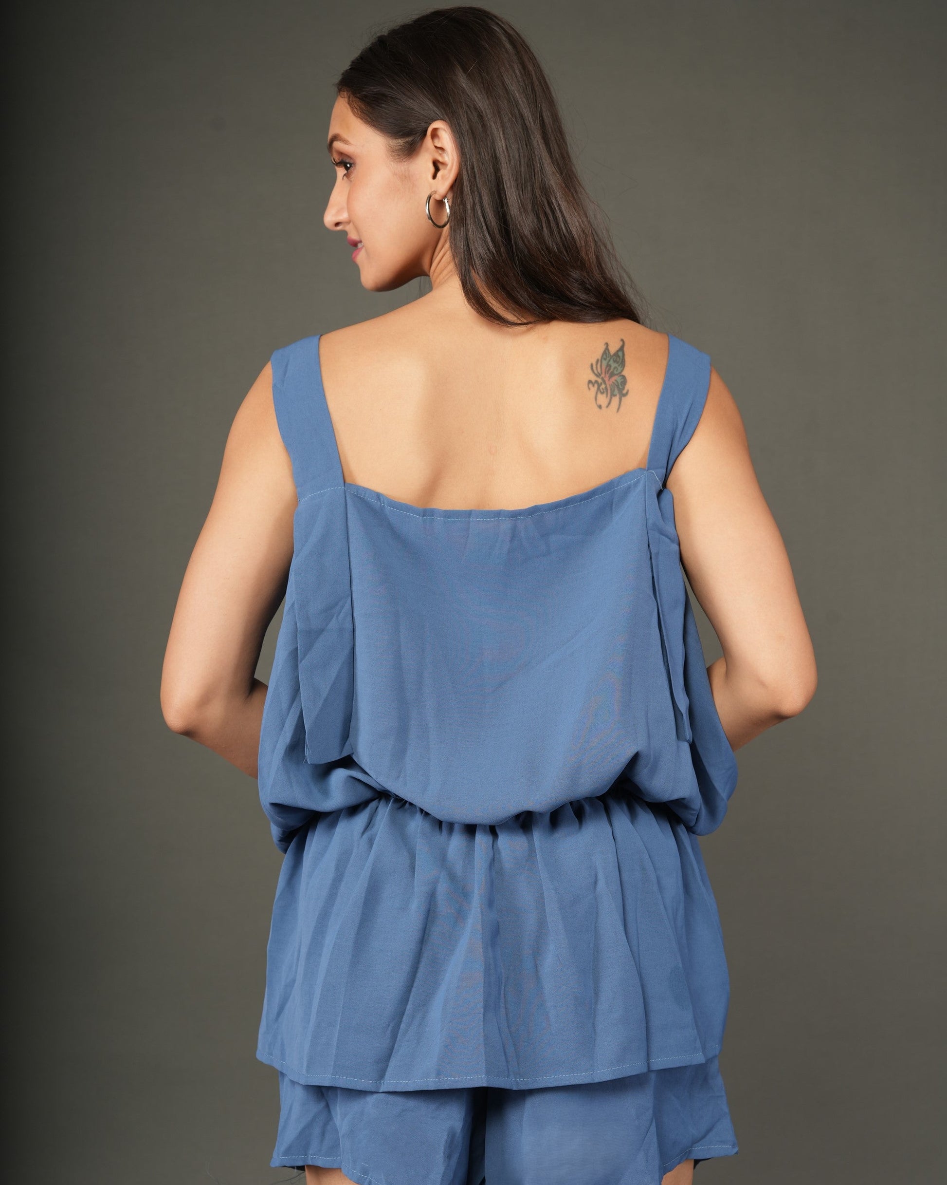 Woman wearing a blue layered outfit