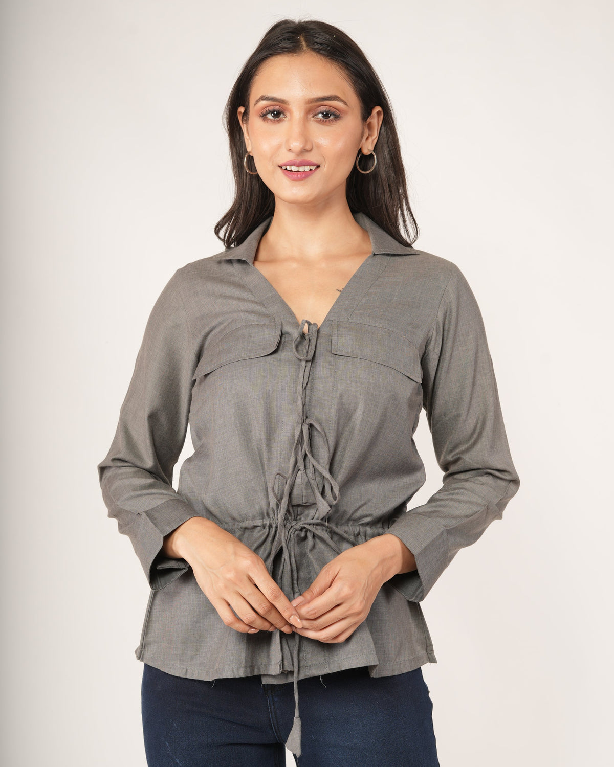 A woman modeling a gray long-sleeve top