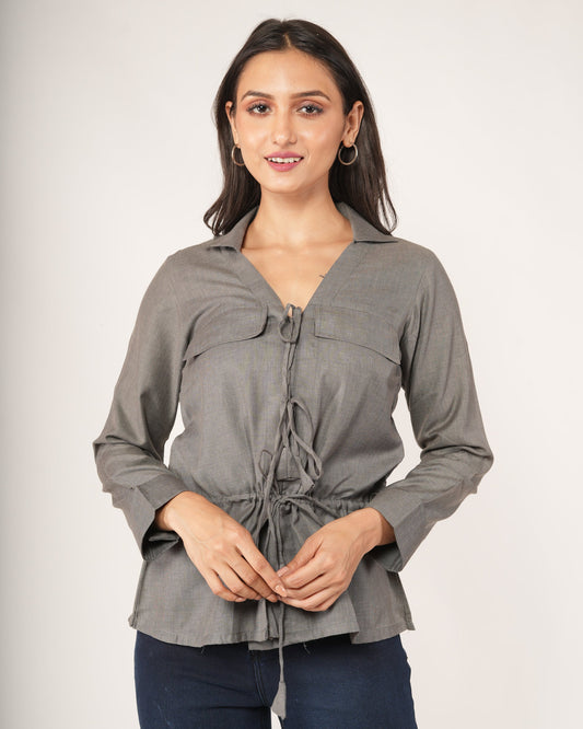A woman modeling a gray long-sleeve top