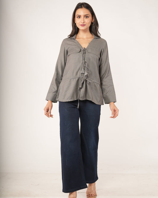 A woman modeling a gray long-sleeve top