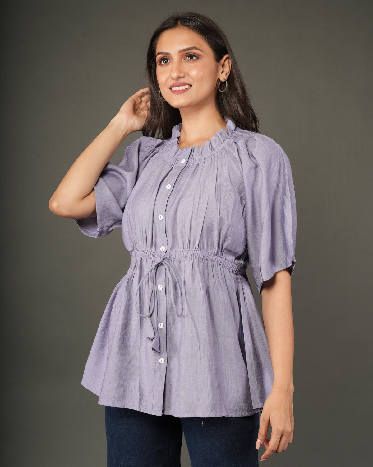 A woman modeling a lavender short-sleeve peplum top