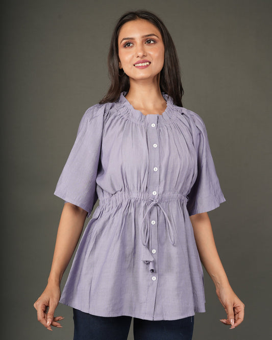 A woman modeling a lavender short-sleeve peplum top