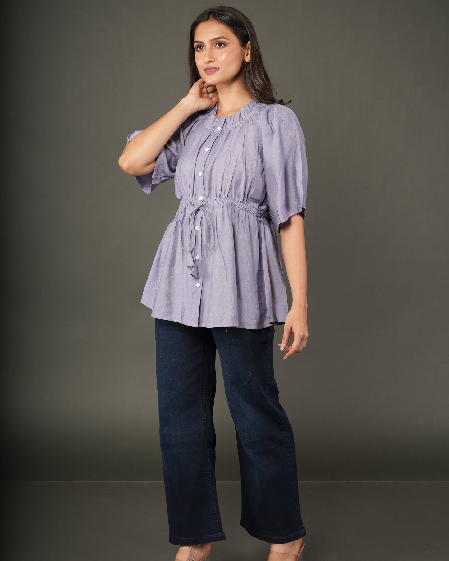 A woman modeling a lavender short-sleeve peplum top