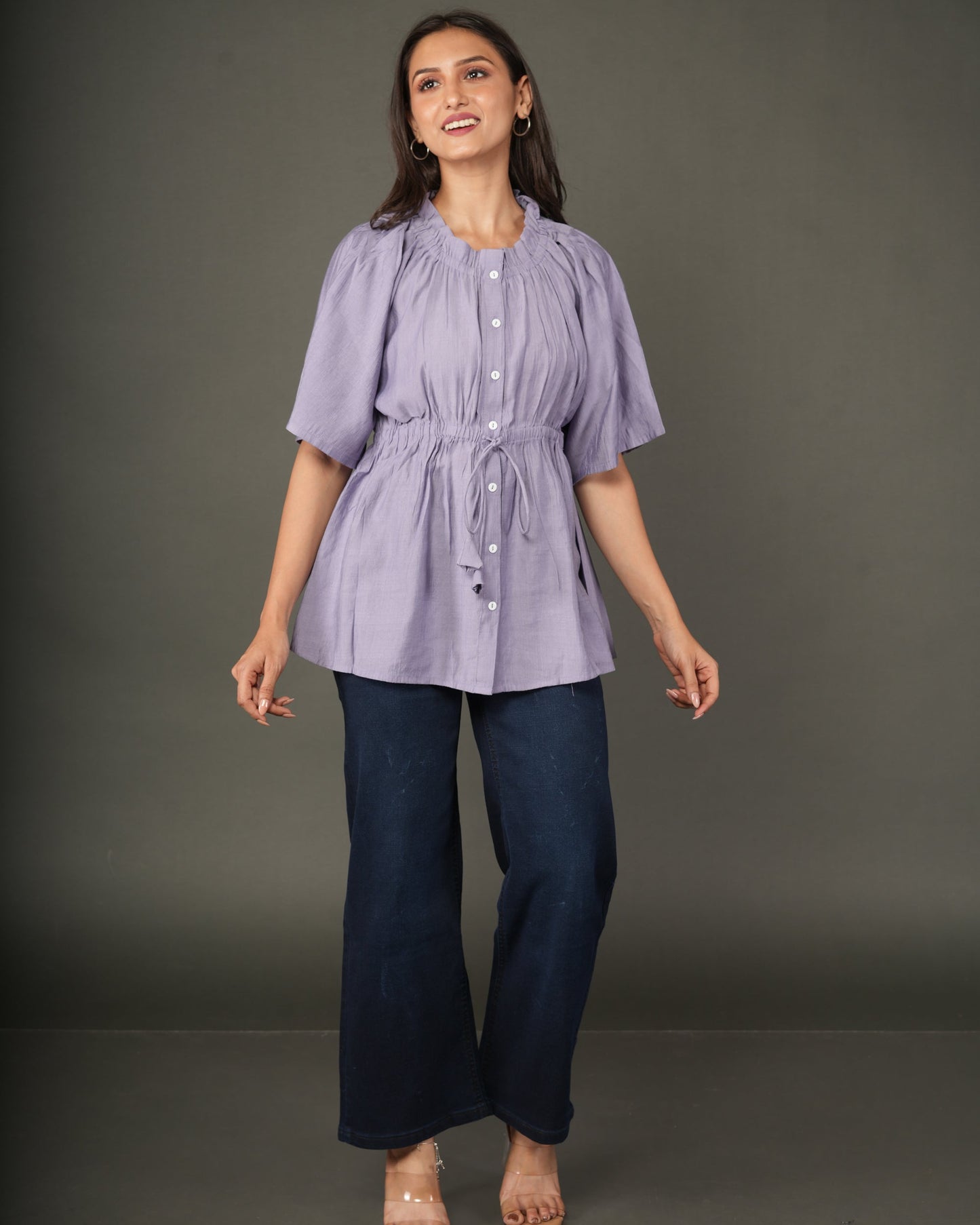 A woman modeling a lavender short-sleeve peplum top