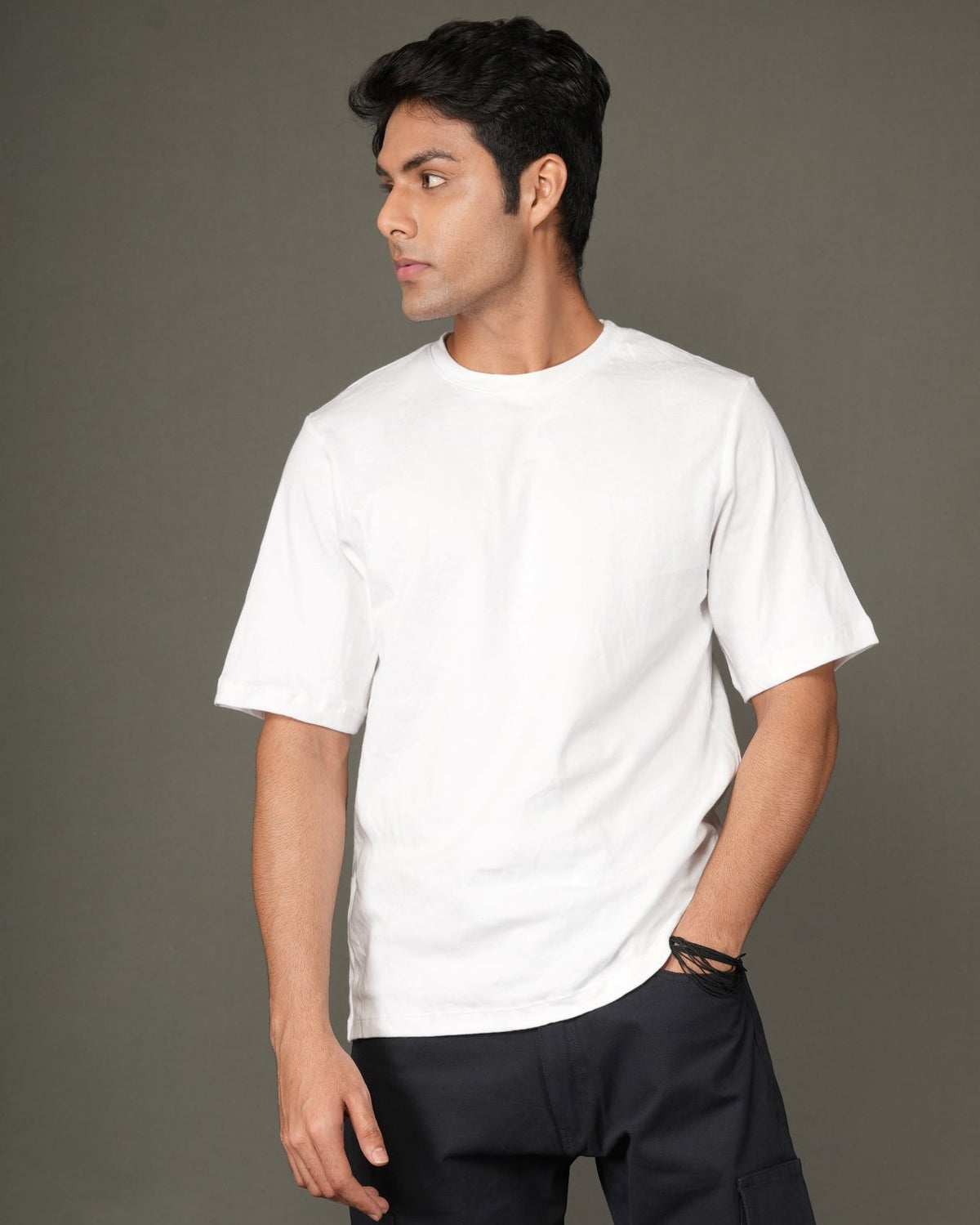 A man with a white crew-neck t-shirt