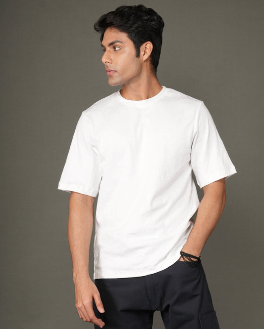 A man with a white crew-neck t-shirt