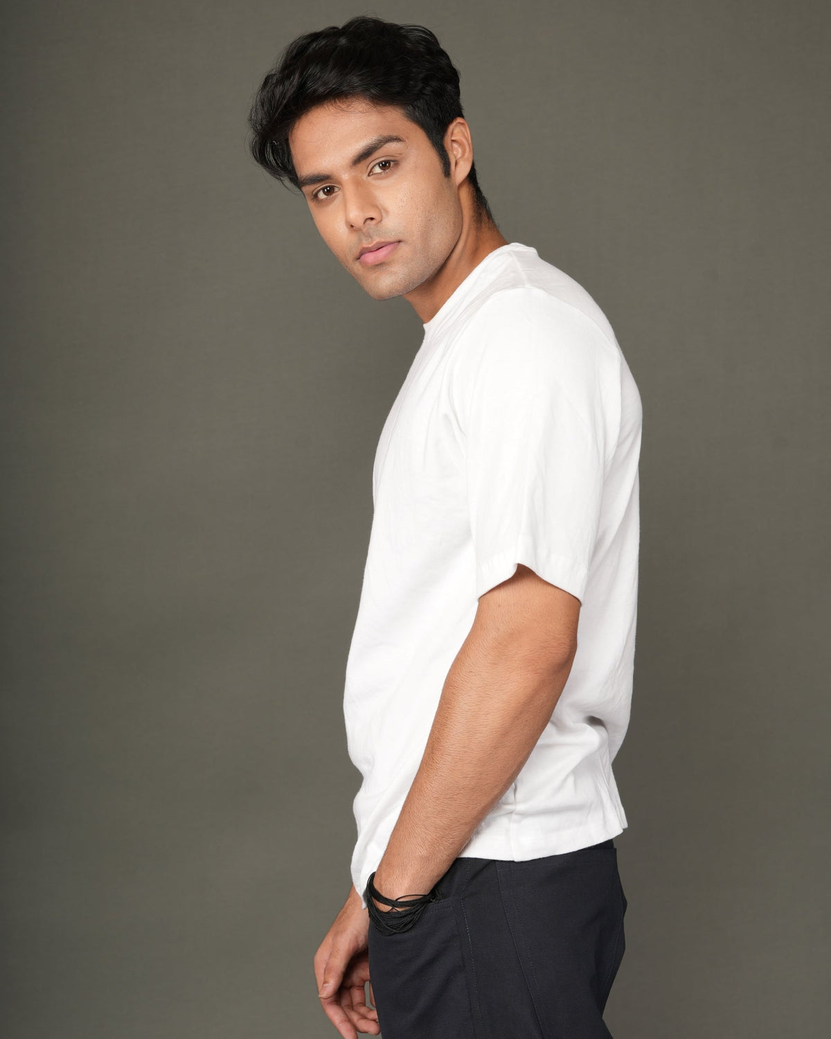 A man with a white crew-neck t-shirt