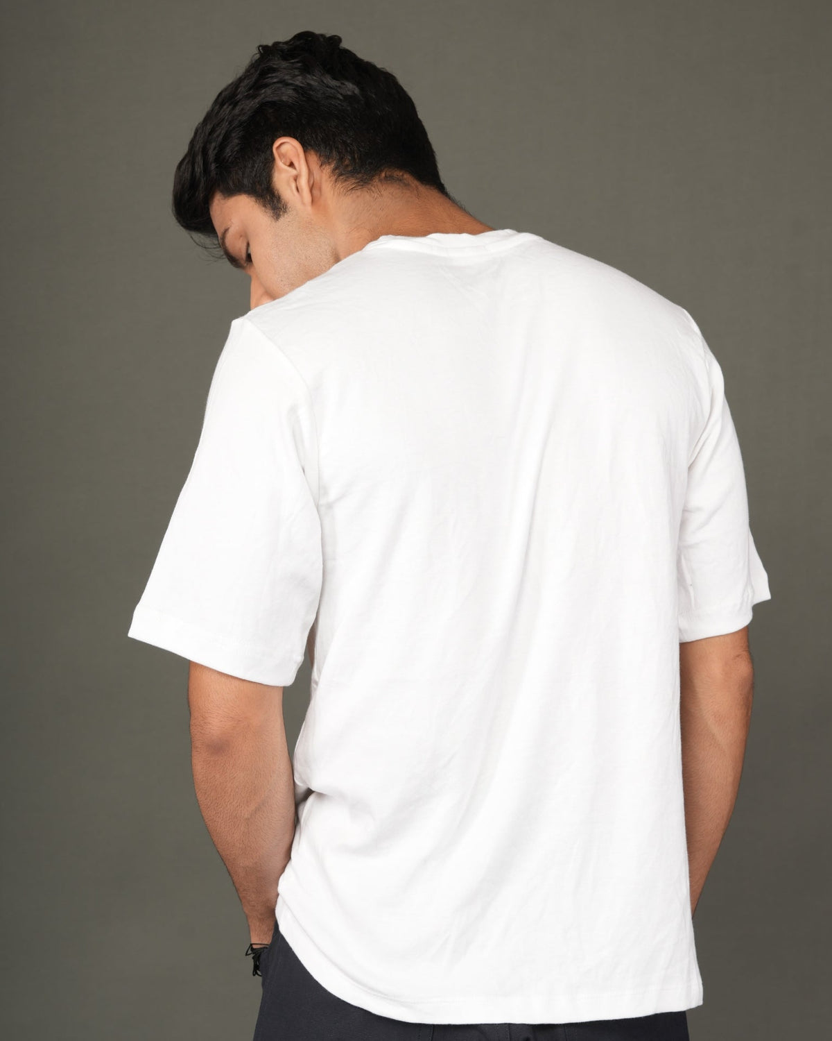 A man with a white crew-neck t-shirt