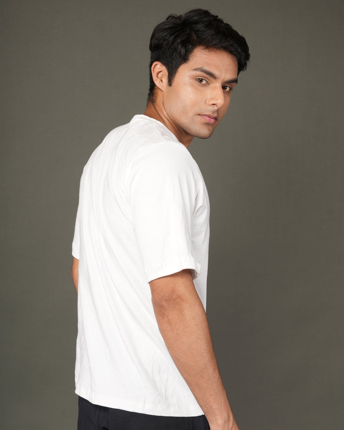 A man with a white crew-neck t-shirt